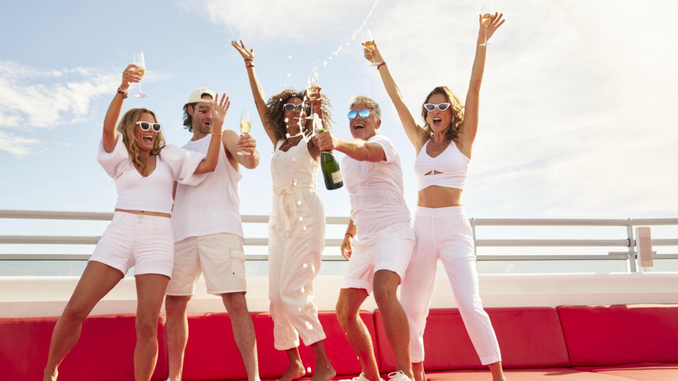 people drinking champagne on a cruise
